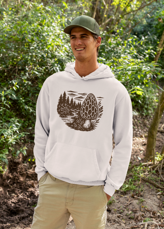 mockup-of-a-happy-man-wearing-a-hoodie-in-the-woods-32227.png