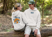 hoodie-mockup-of-a-couple-sitting-together-in-the-woods-32224.png