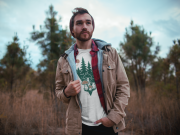 dude-with-beard-wearing-a-tshirt-mockup-watching-the-landscape-outdoors-a19030.png