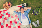 t-shirt-mockup-of-a-man-lying-on-a-picnic-blanket-34091-r-el2.png