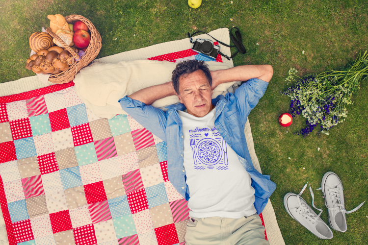 t-shirt-mockup-of-a-man-lying-on-a-picnic-blanket-34091-r-el2.png