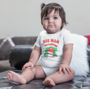 mockup-of-a-sad-baby-girl-wearing-a-onesie-sitting-on-a-leather-couch-a14049.png